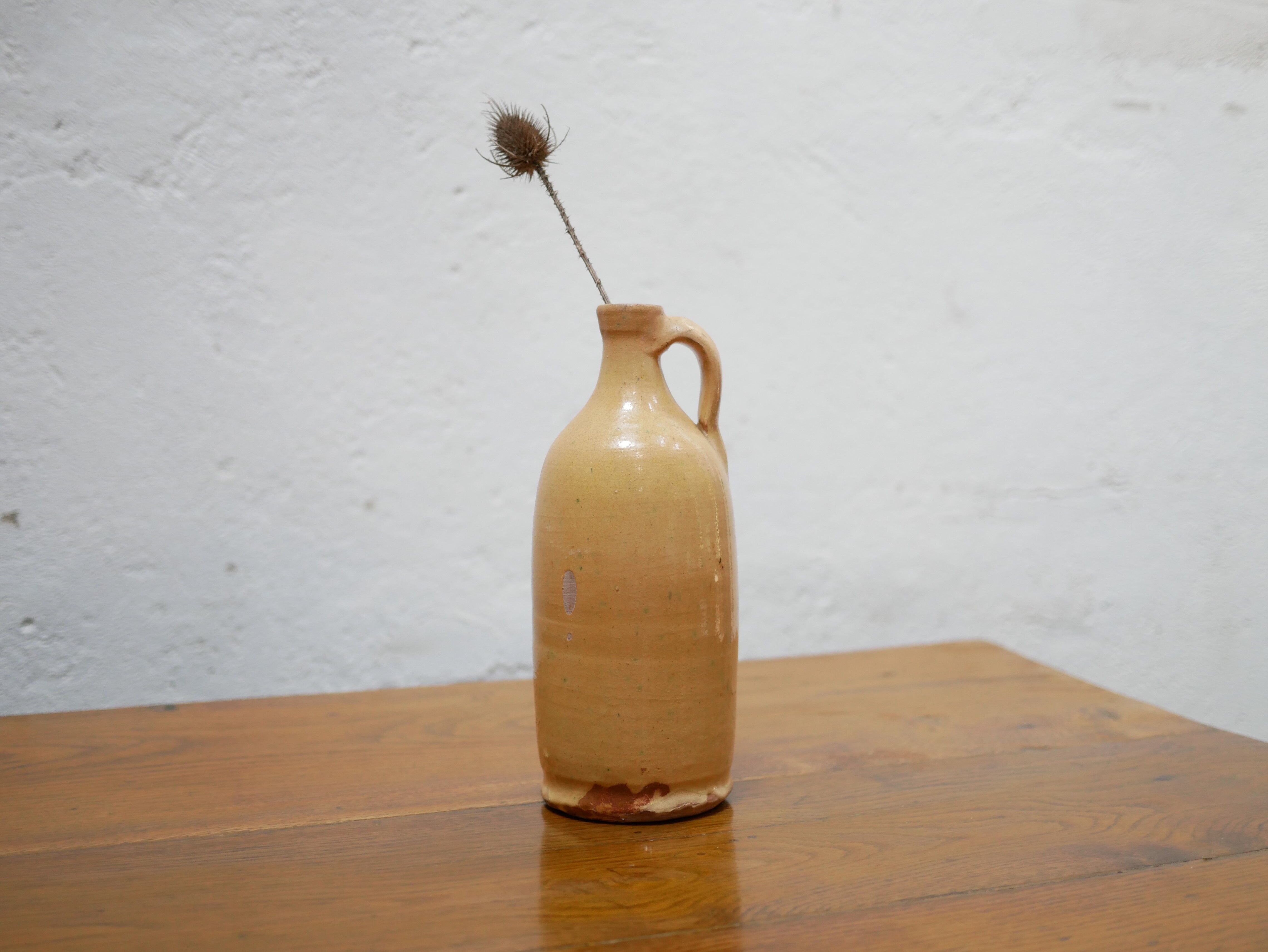 Vintage glazed terracotta bottle