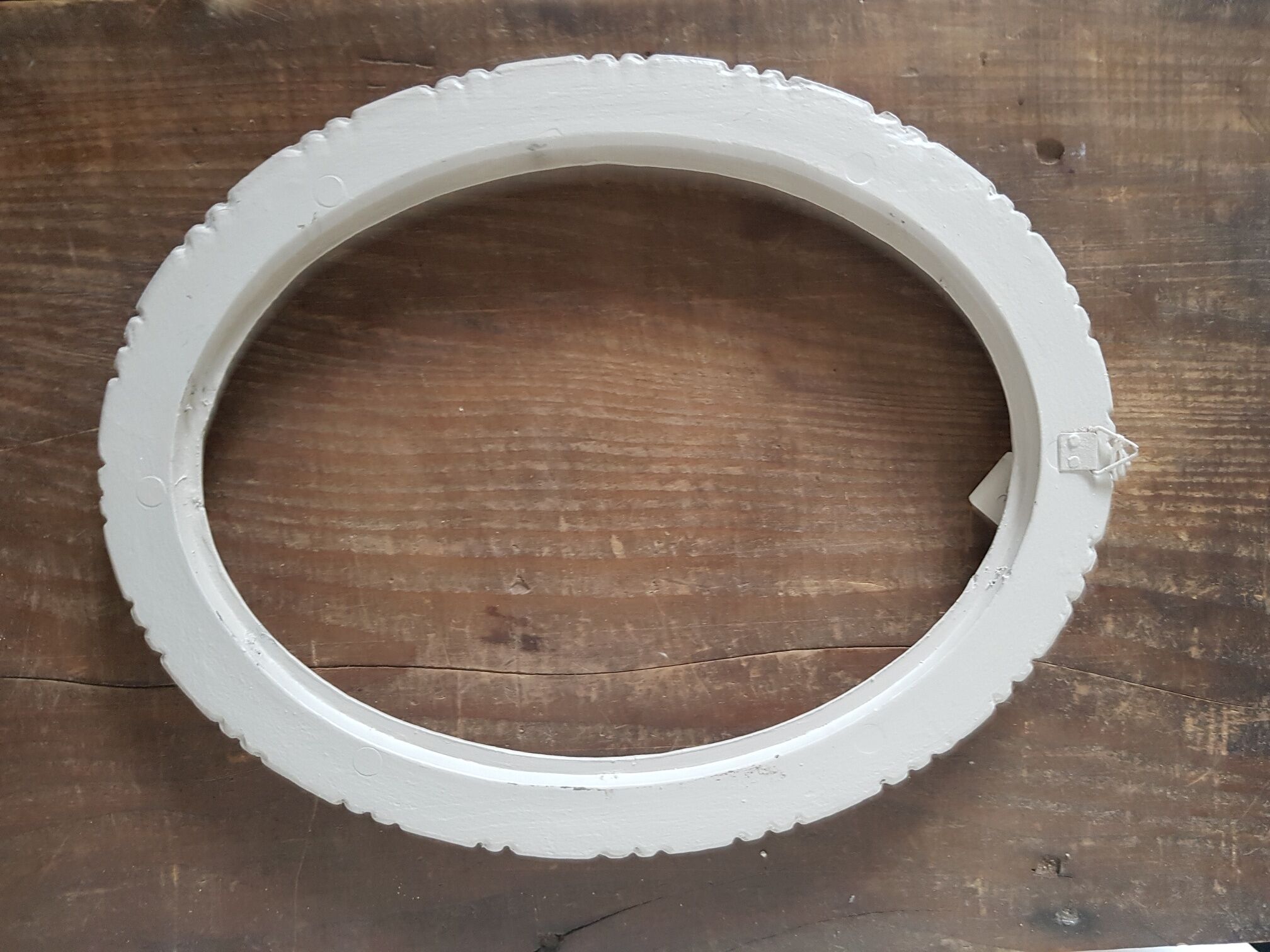 Oval frame patinated linen