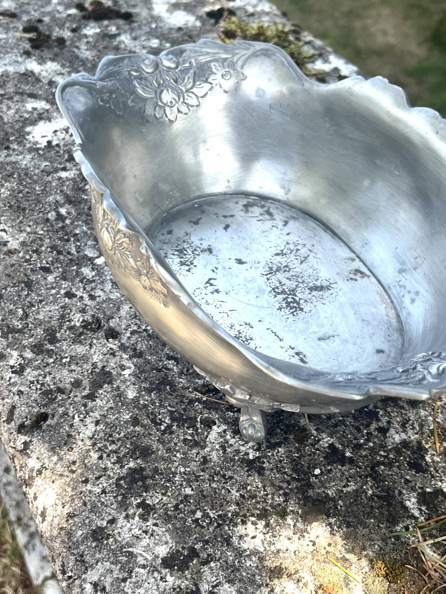 Footed pewter champagne cooler on claw feet with floral relief