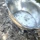 Footed pewter champagne cooler on claw feet with floral relief