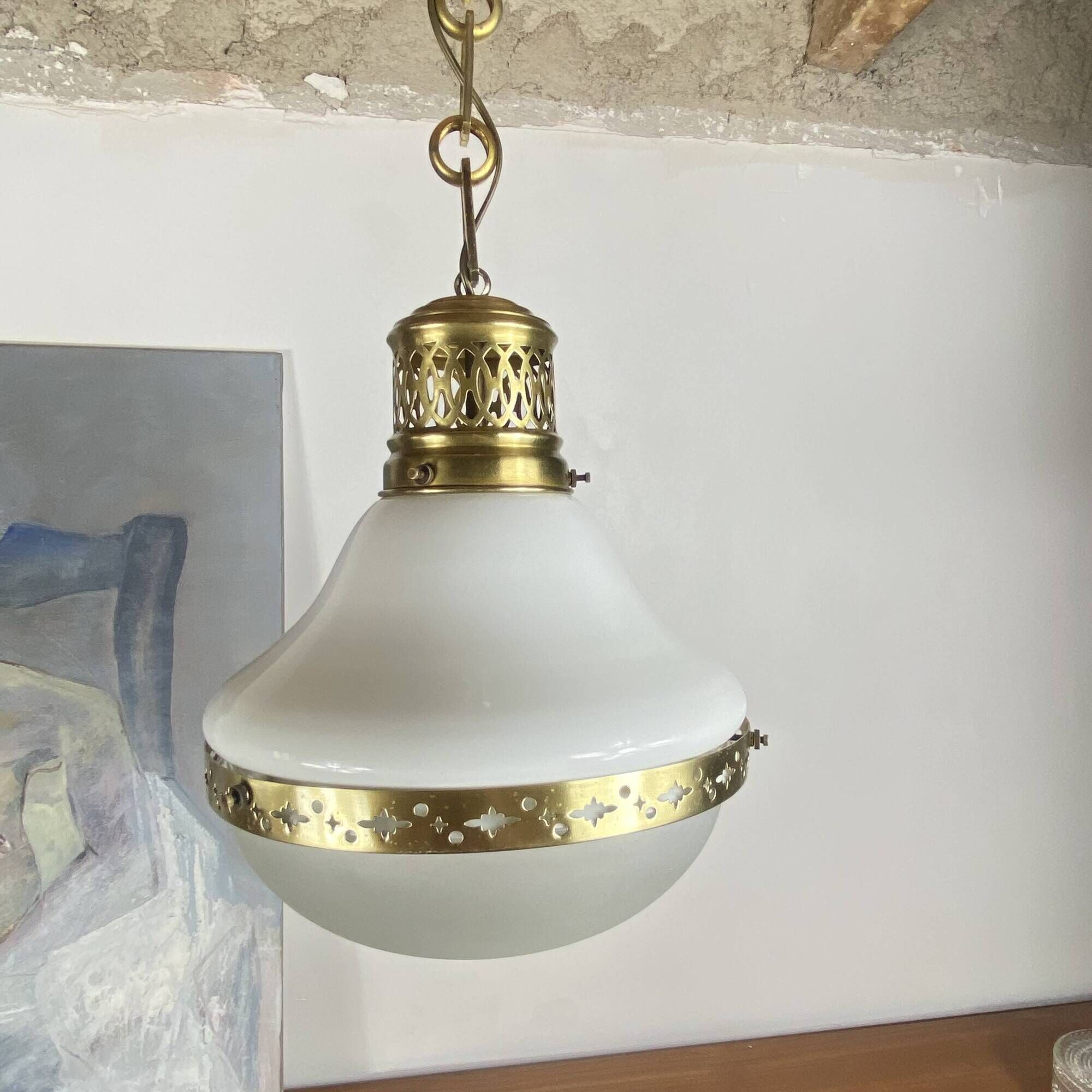 Suspension in white opaline glass and brass 1920 with a gilded brass chain.