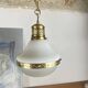 Suspension in white opaline glass and brass 1920 with a gilded brass chain.