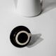 Vintage ceramic coffee pot or teapot from the 1980s, postmodern Memphis design, black and white triangles.