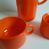 Coffee pot has orange 1970 sugar milk