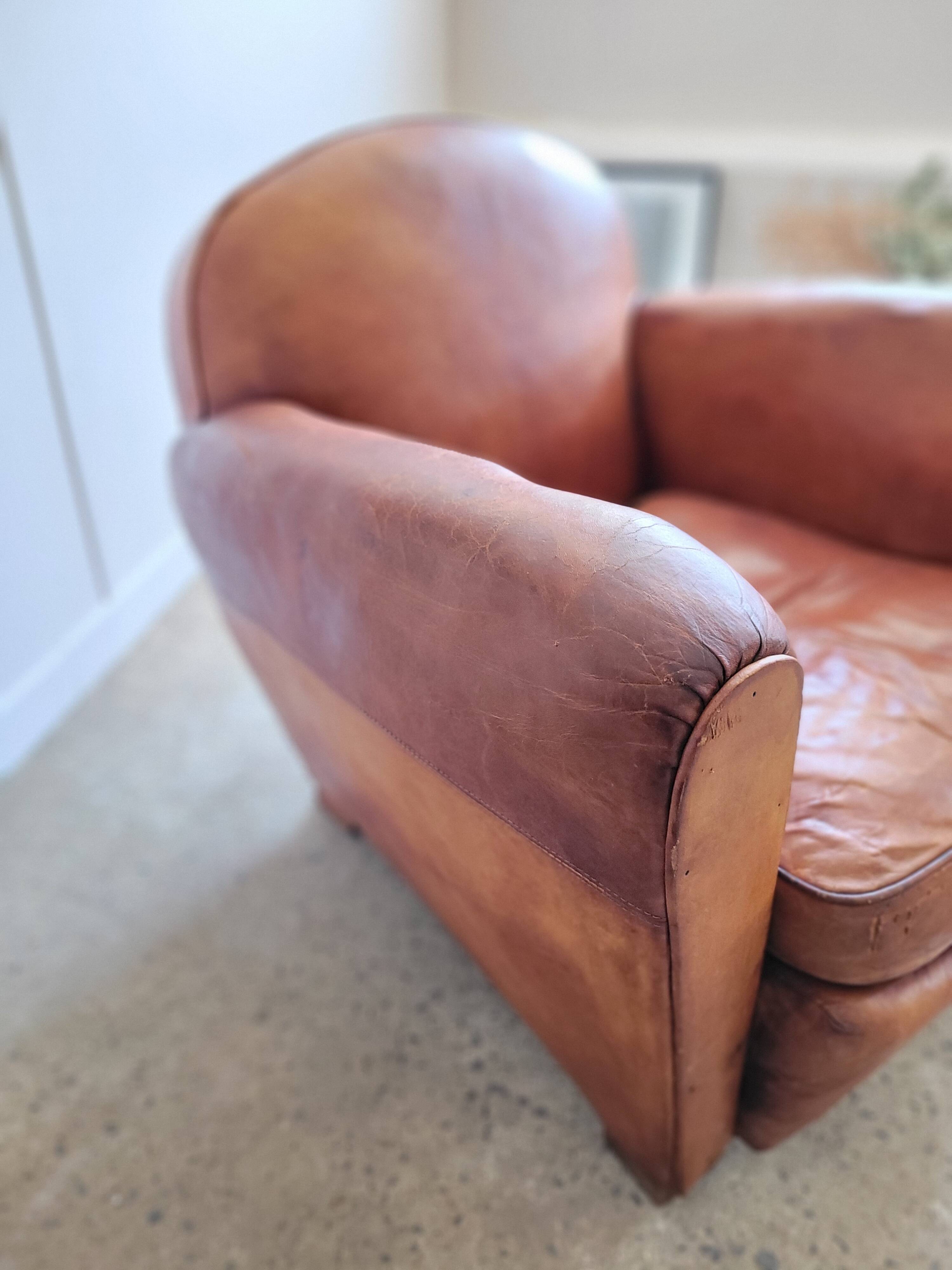 Fauteuil club en cuir patiné