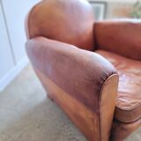 Fauteuil club en cuir patiné