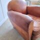 Patinated leather club armchair