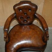 High Victorian leather tête-à-tête canapé with a walnut burr chessboard.