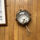 Industrial porthole wall light in Bakelite with glass globe.