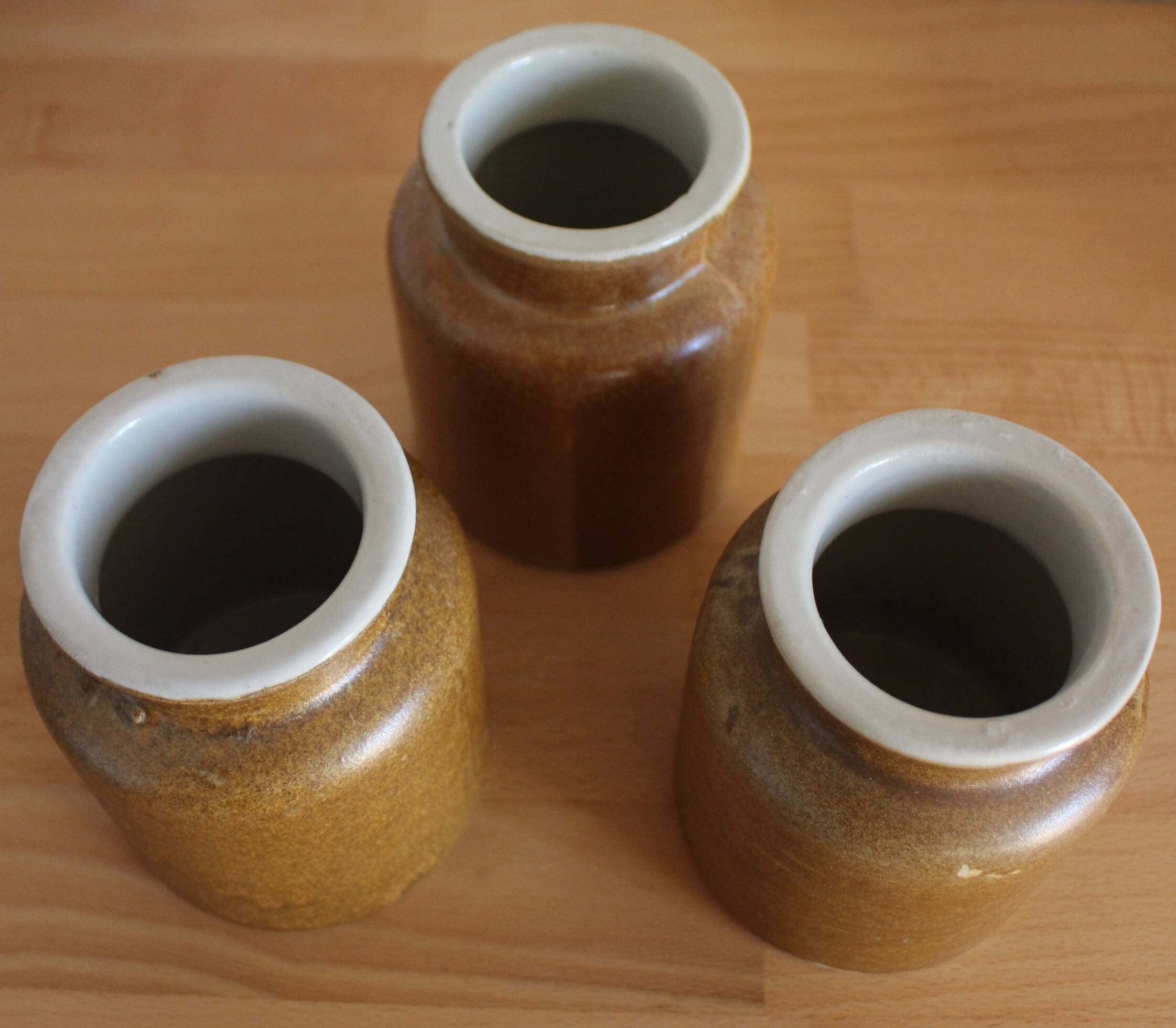 A set of 3 vintage glazed stoneware vases for indoor use.