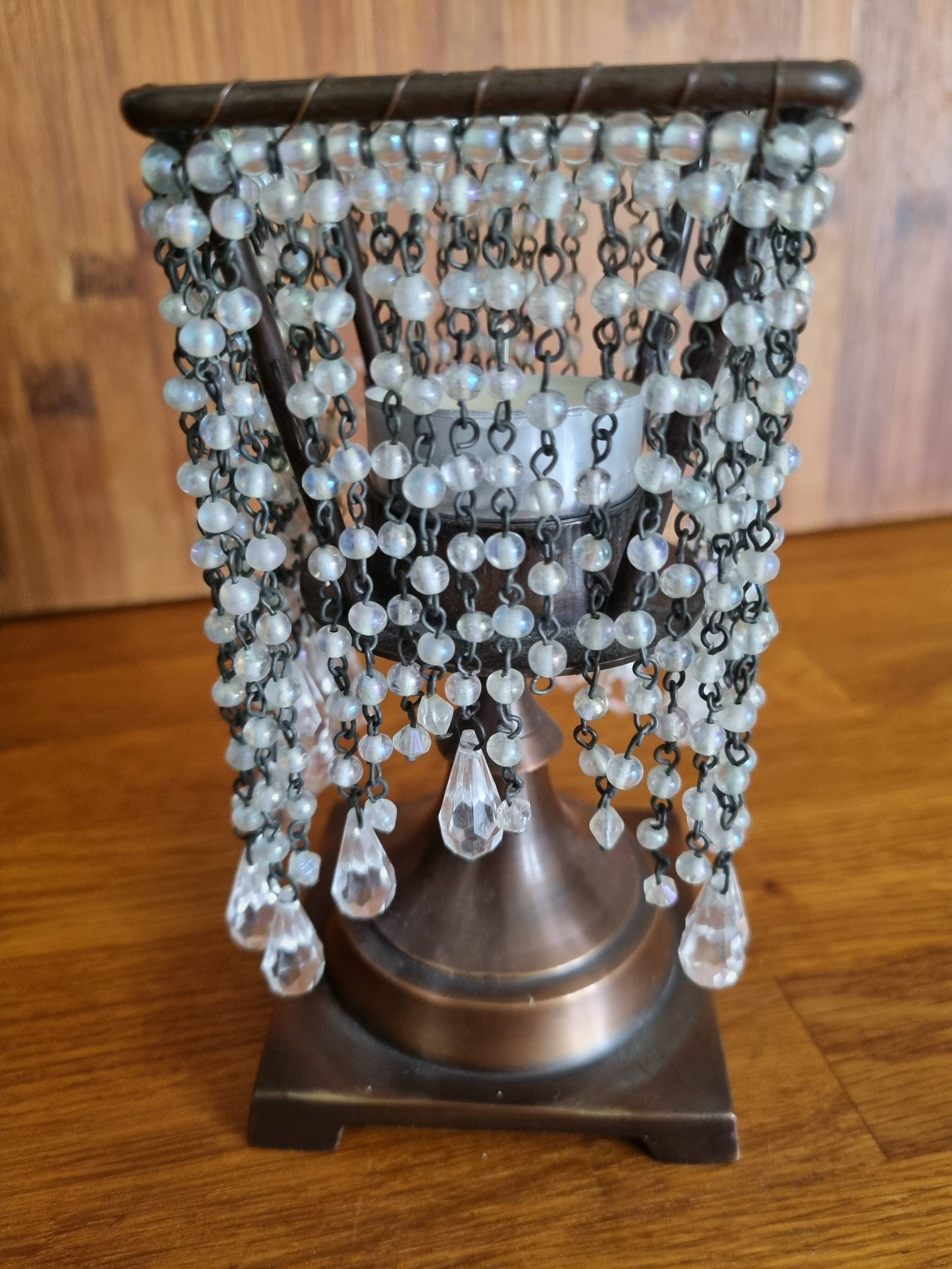 Metal candle holder with white glass tassels