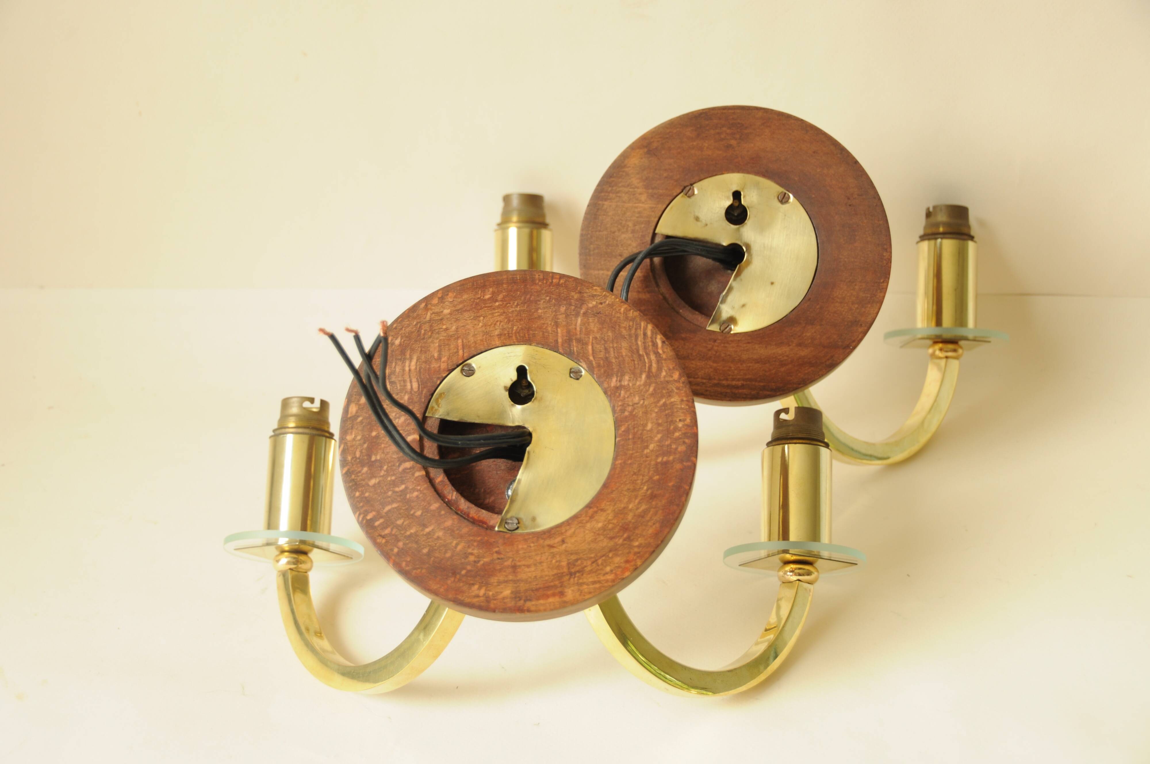Pair of vintage wall sconces in polished gold brass, wood and glass