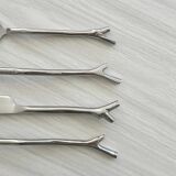 Set of 20 stainless steel cutlery with branch pattern.