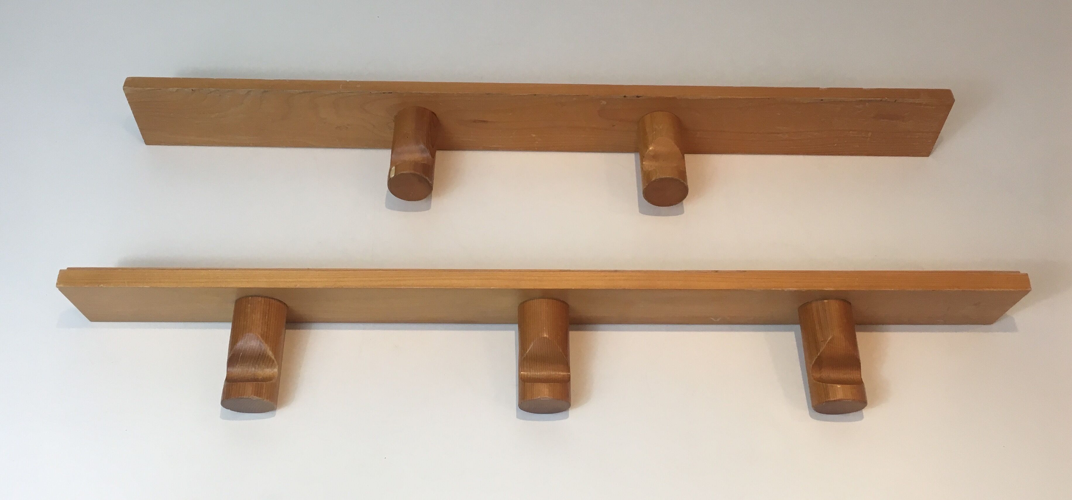 Charlotte Perriand, pair of fir wall coat racks, French work, around 1970