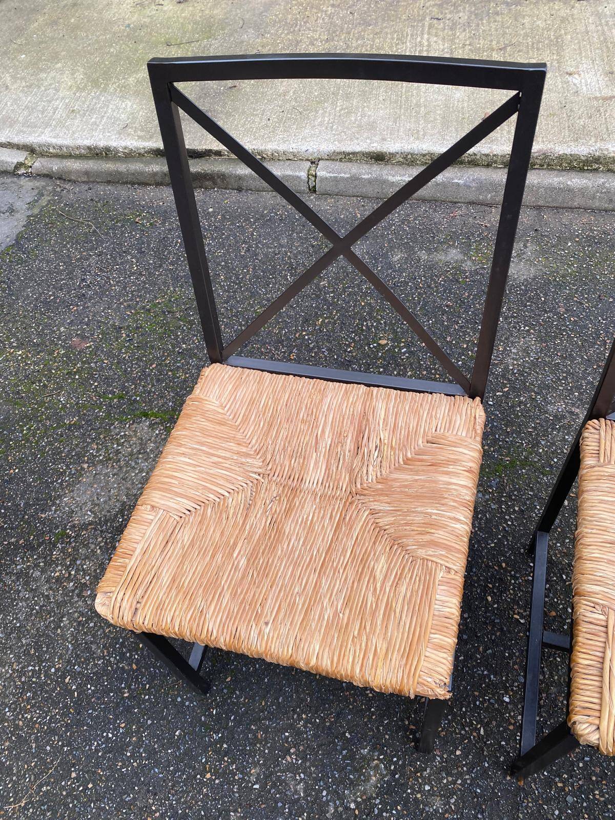 2 Scandinavian chairs with black steel and straw from IKEA Granas.