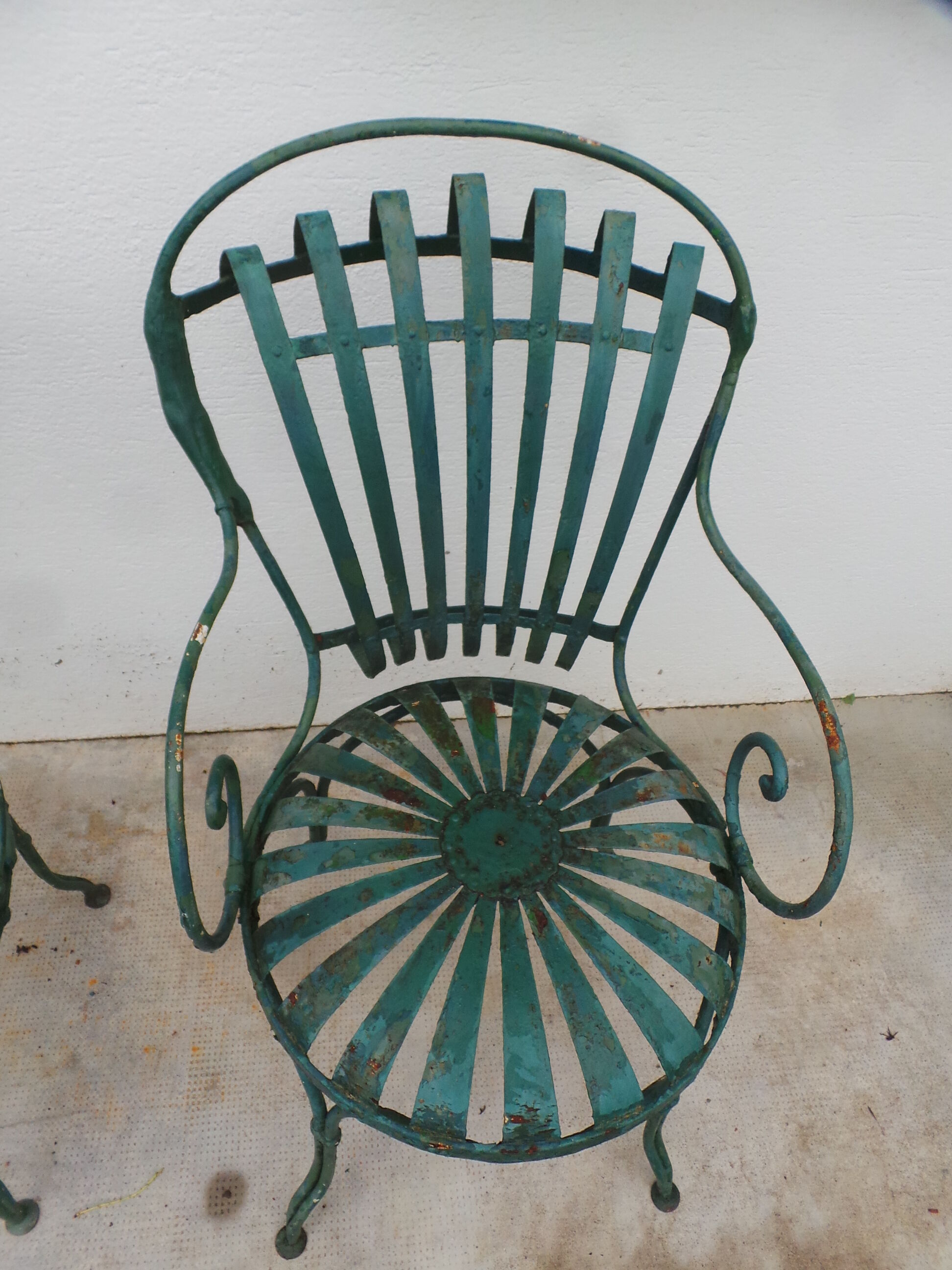 Pair of wrought iron garden chairs by François Carre