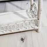 White woven wicker shelf