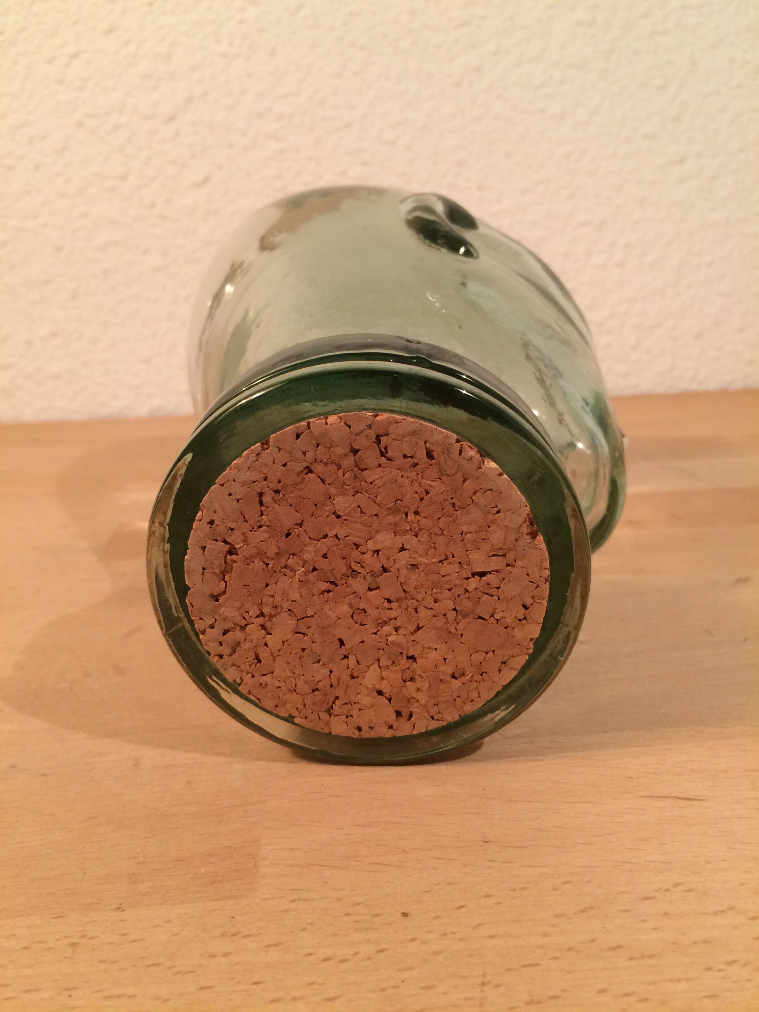 Molded glass head curiosity cabinet