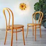 Pair of 1970s bistro chairs in bentwood and caning.