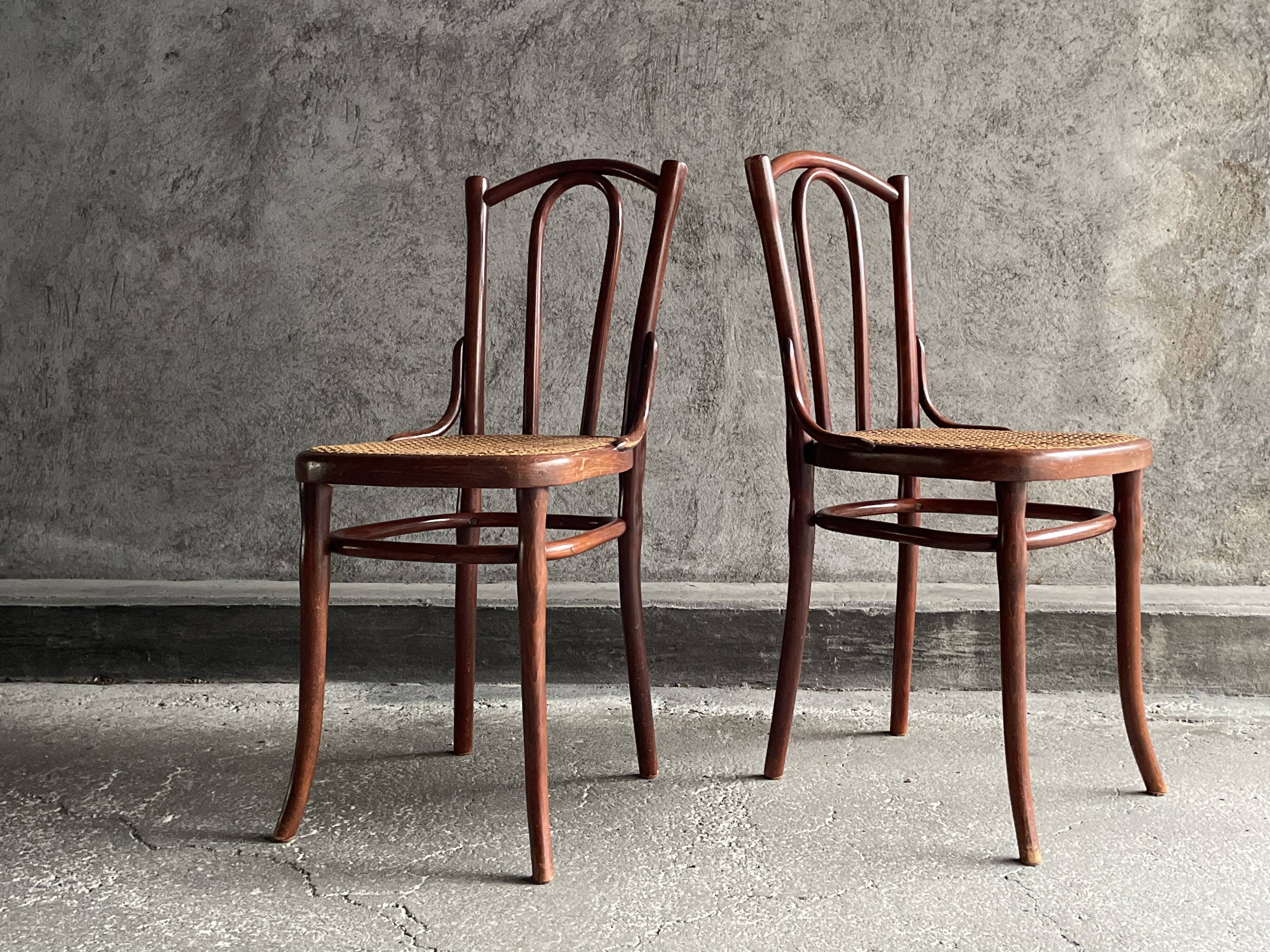 Pair of caned bistro chairs by Thonet