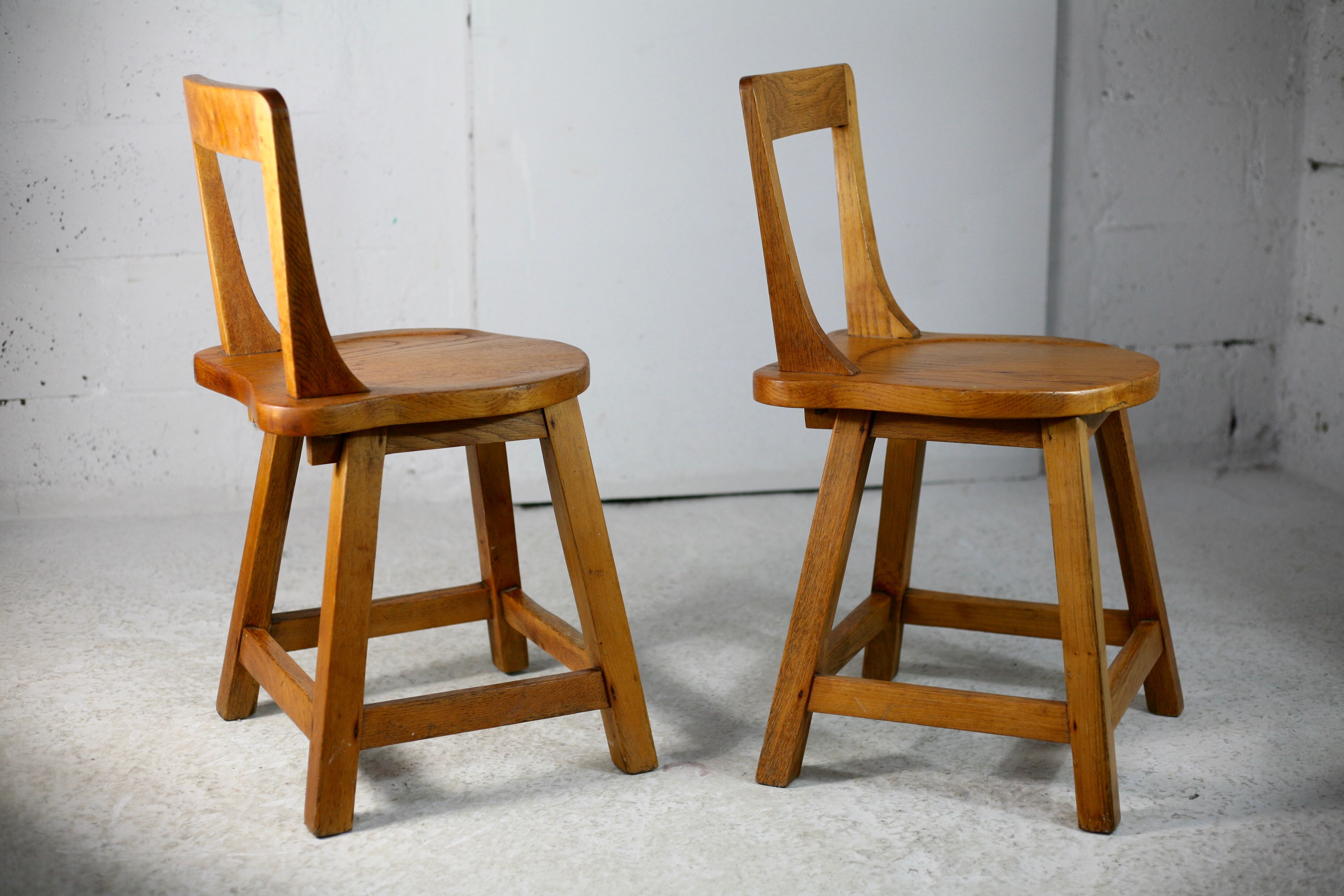 Pair of brutalist wooden back stools. France, circa 1960