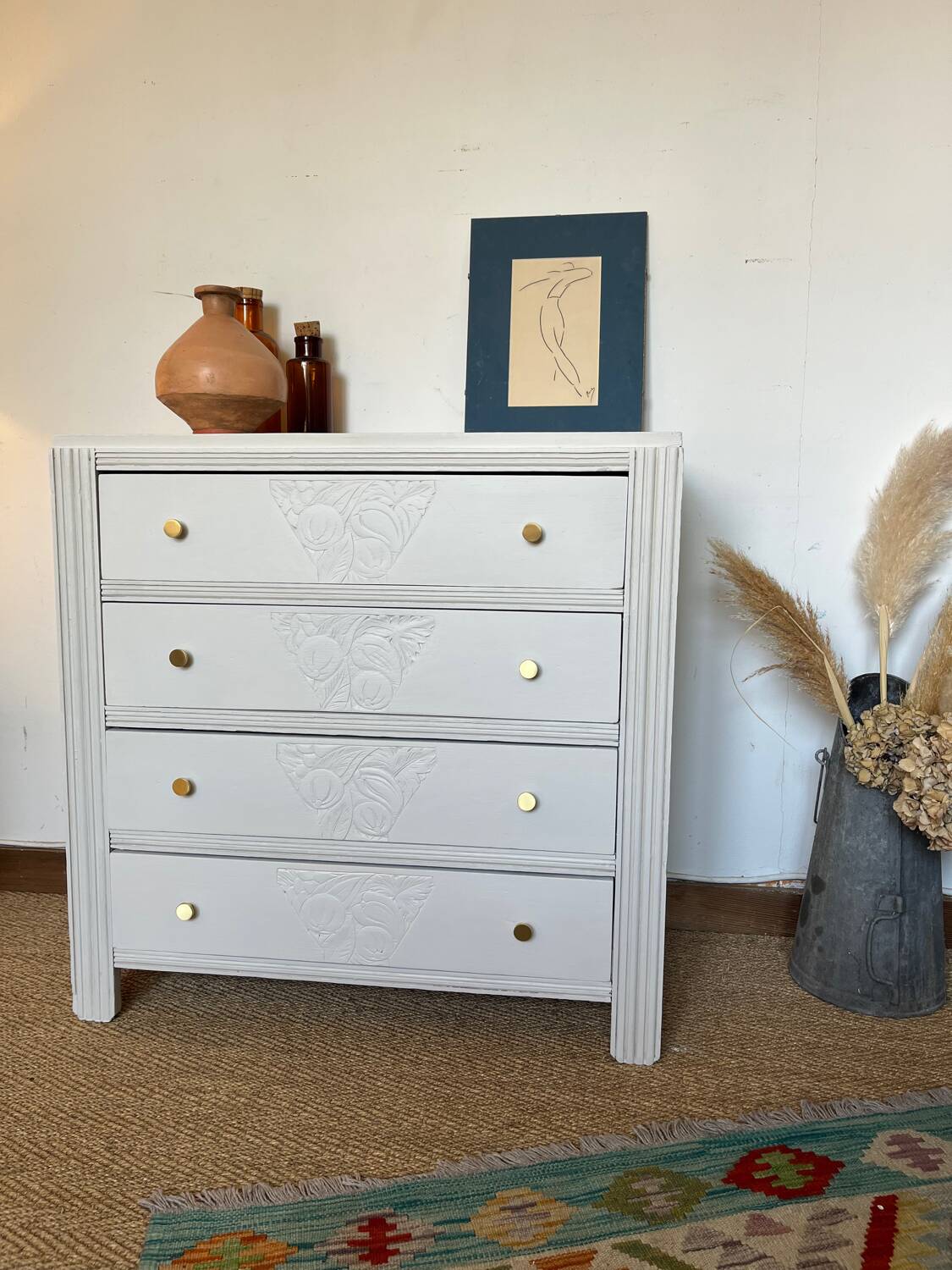 Restored wooden art deco chest of drawers with gilded handles