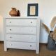 Restored wooden art deco chest of drawers with gilded handles