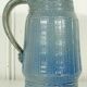 Pitcher in glazed blue sandstone signed