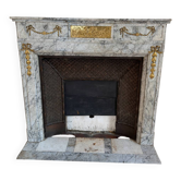 Louis XVI fireplace in veined grey marble with original gilded bronzes from the 19th century.