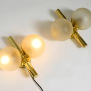 Pair of beautiful 60s Kaiser brass wall lamps with two golden glass spheres