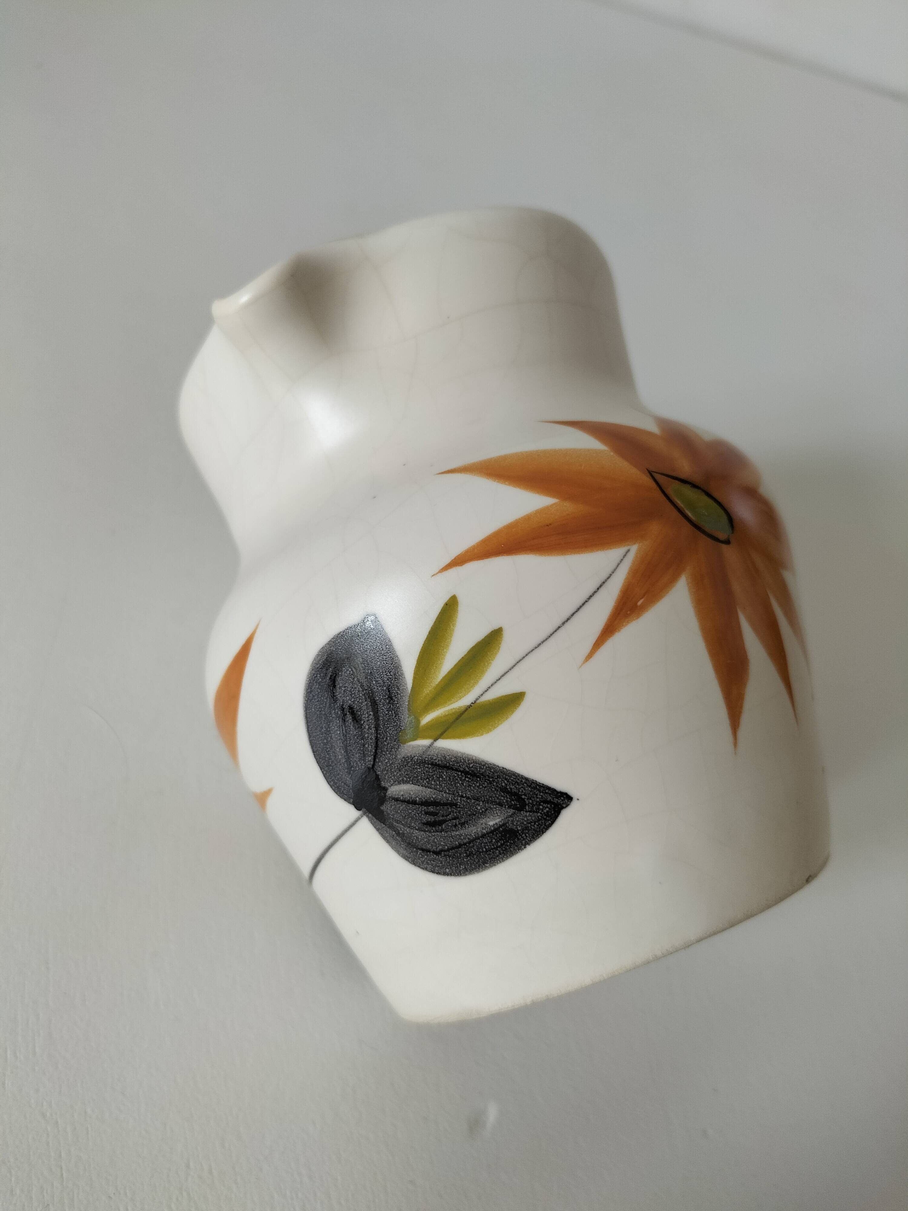 Vintage Marais pottery pitcher with orange floral decoration