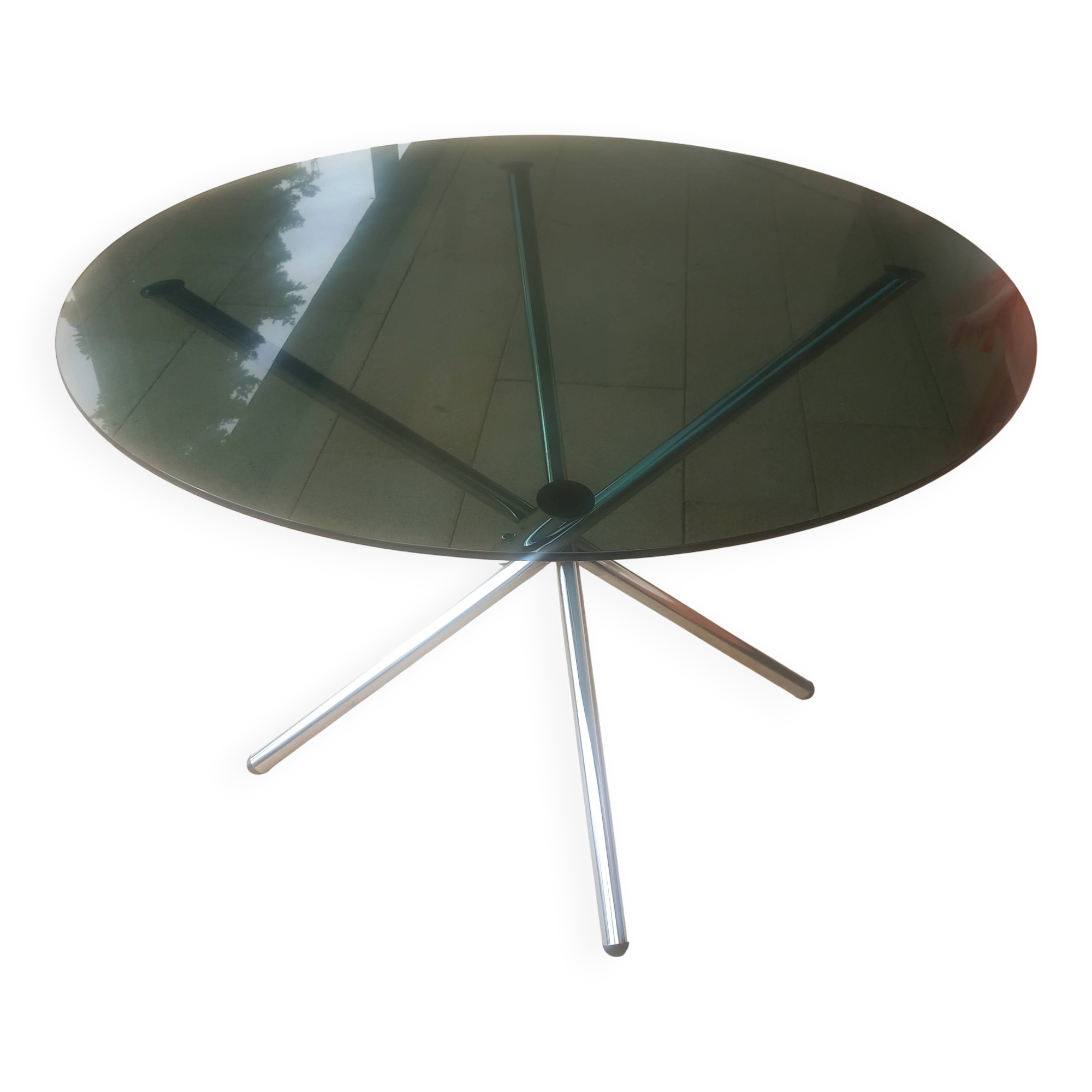 Round smoked glass table from the 70s. Foldable stainless steel legs.