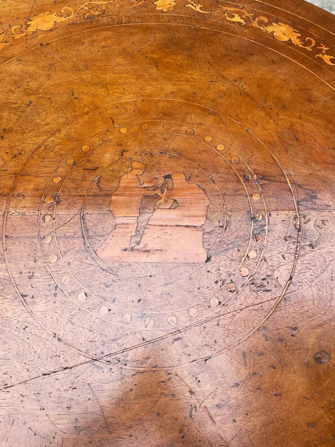 Antique round marquetry Empire table from the early 19th century