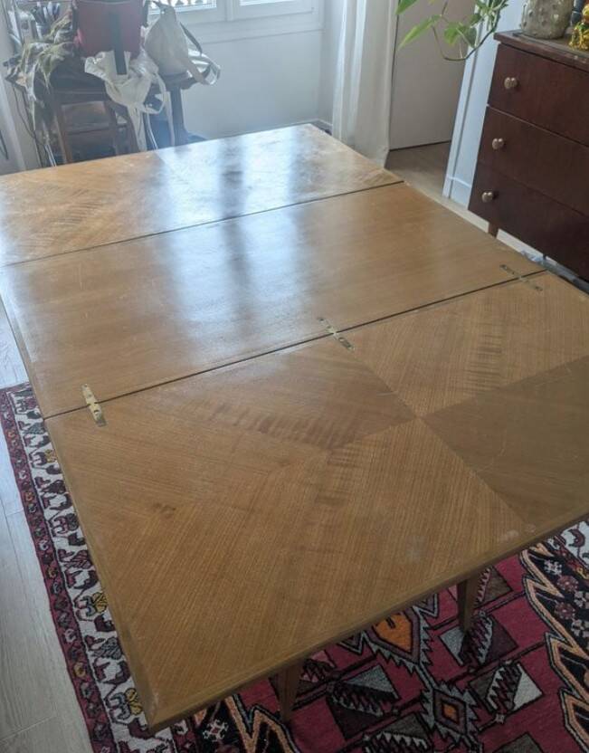 Lift-top coffee table that converts into a dining table.