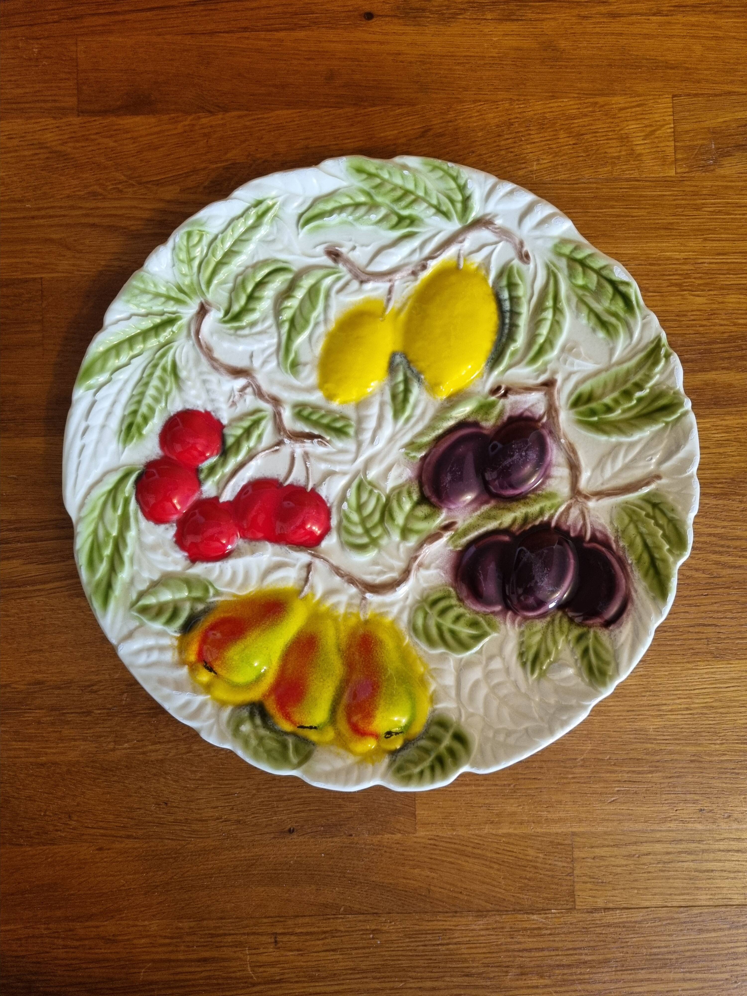 Large vintage earthenware dish with a fruit pattern.