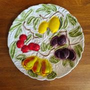 Large vintage earthenware dish with a fruit pattern.
