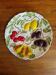 Large vintage earthenware dish with a fruit pattern.