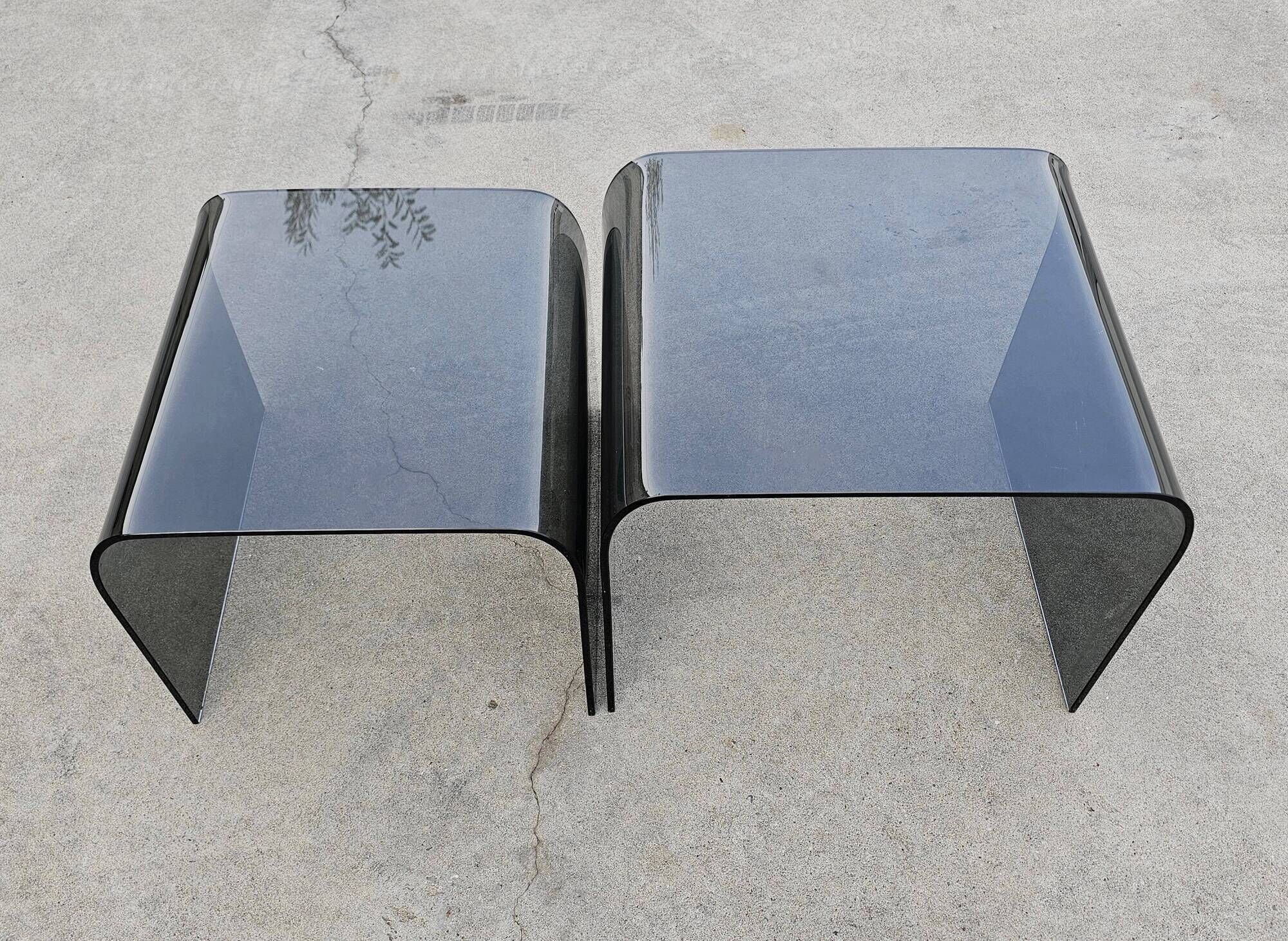 Pair of Waterfall nesting tables in tinted glass attributed to FIAM 1980s.