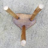 Farm stool in raw wooden sitting in the shape of a popular art