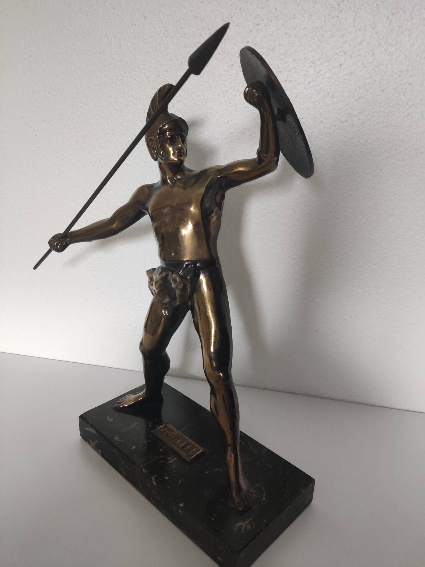 Large statue of Achilles, Greek warrior, marble base, ancient mythology.