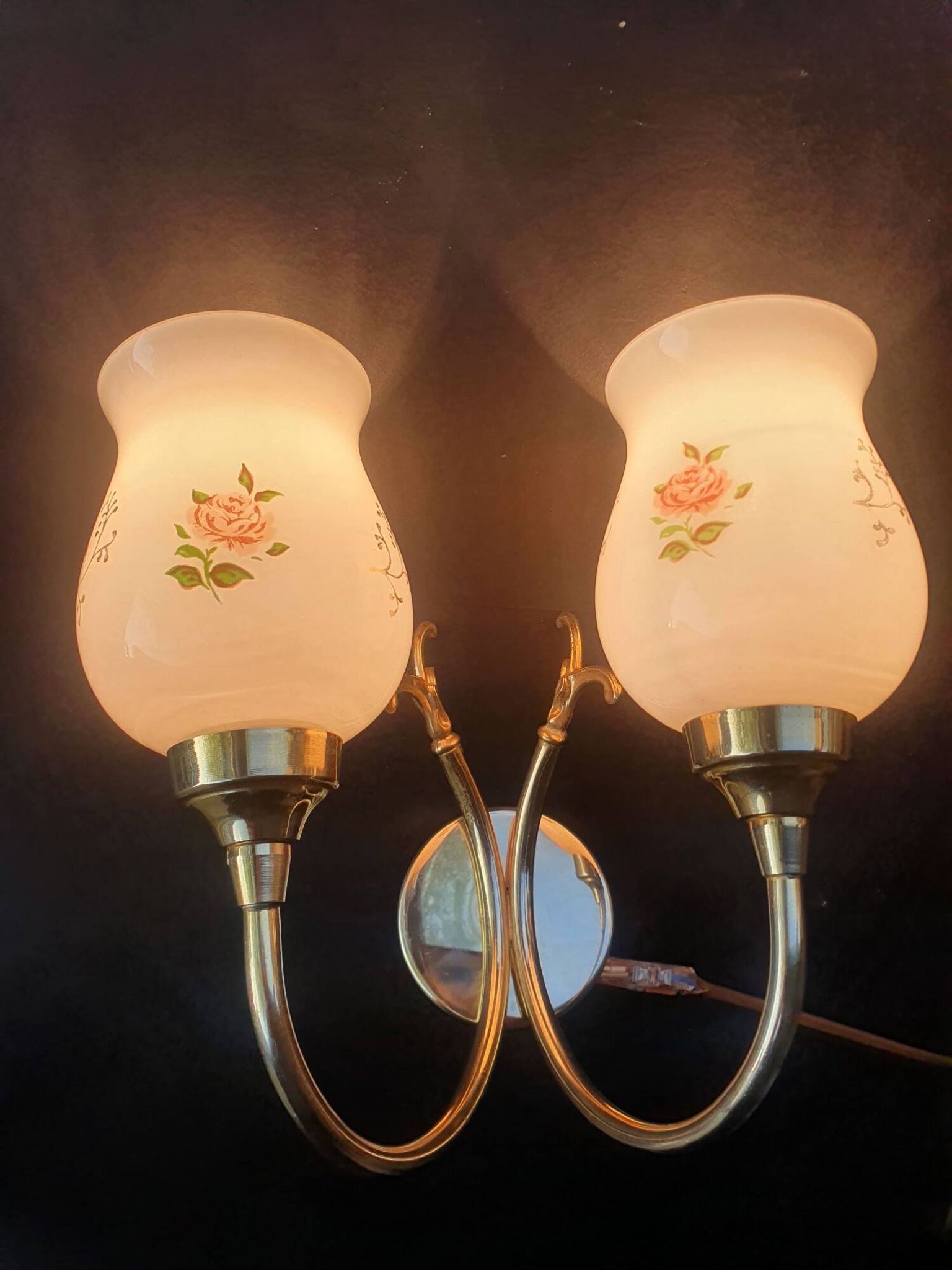 Pair of vintage wall sconces in gilded brass and pink opaline glass.