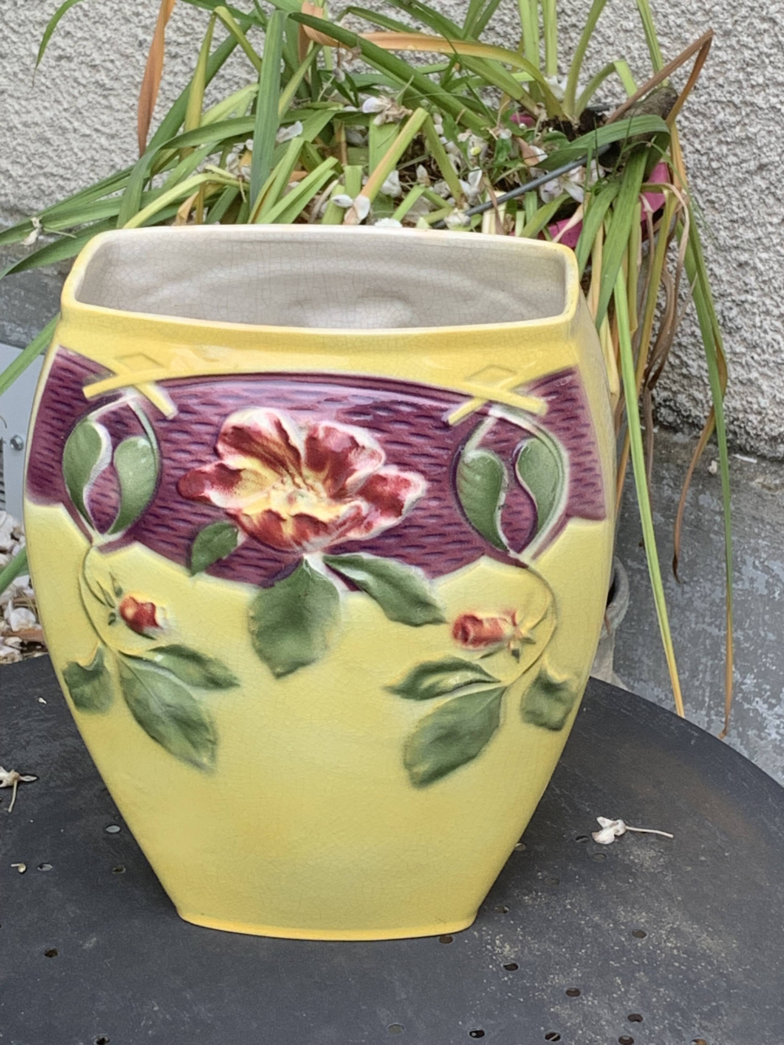 Yellow glazed ceramic slip vase with hawthorn pink flower motif
