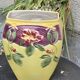 Yellow glazed ceramic slip vase with hawthorn pink flower motif