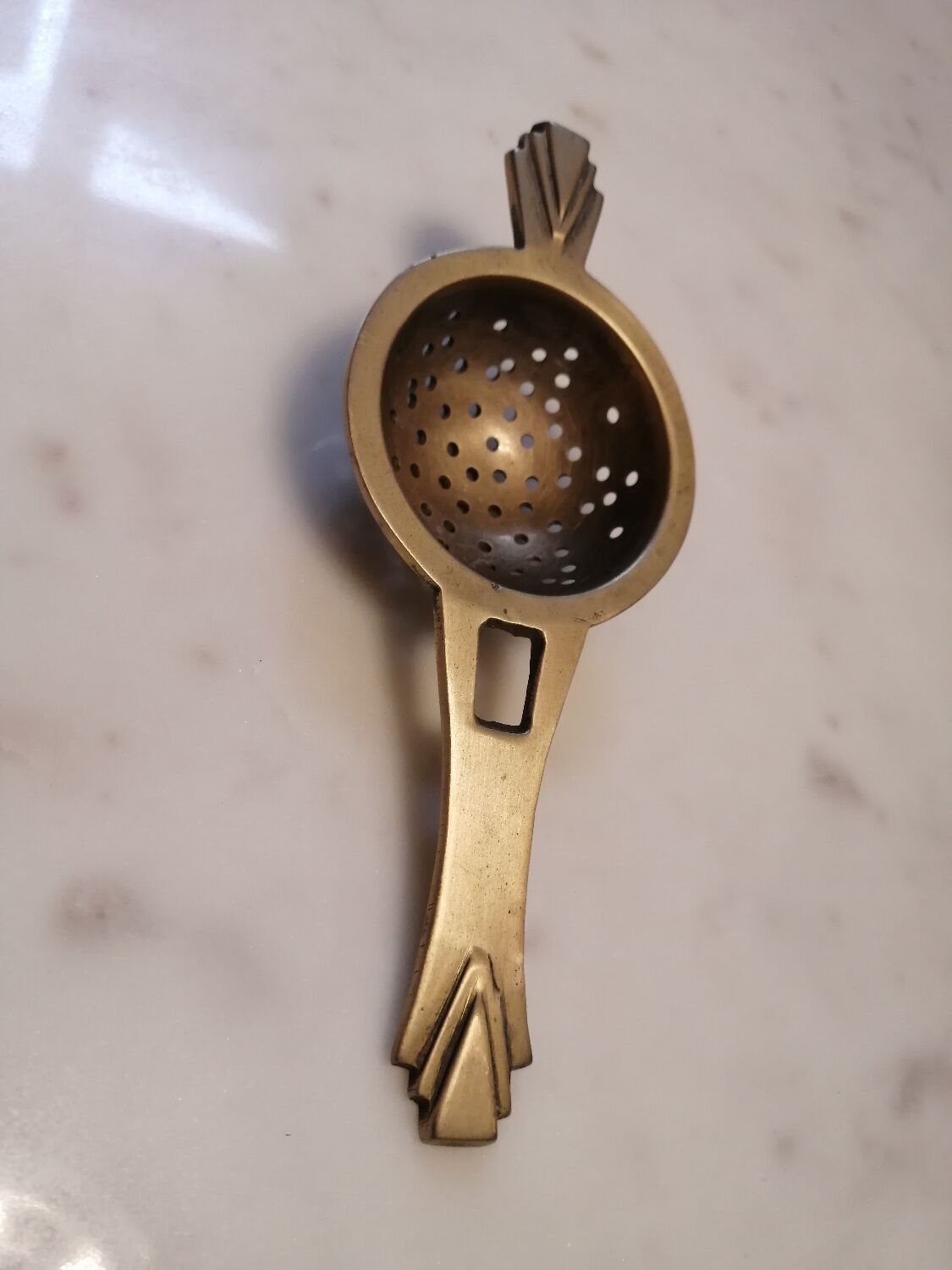 Art deco tea colander
