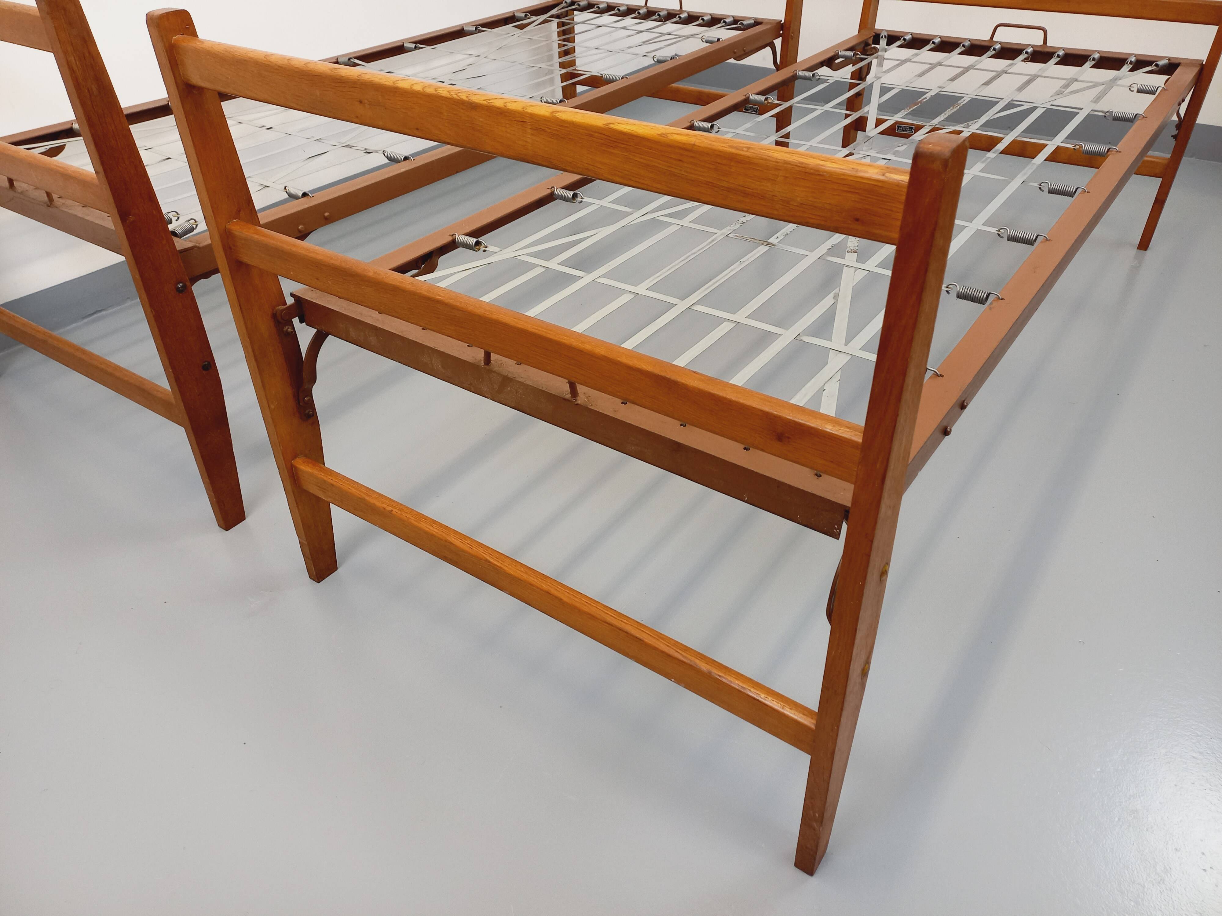 Pair of vintage stackable daybeds in oak wood and metal from the 60s