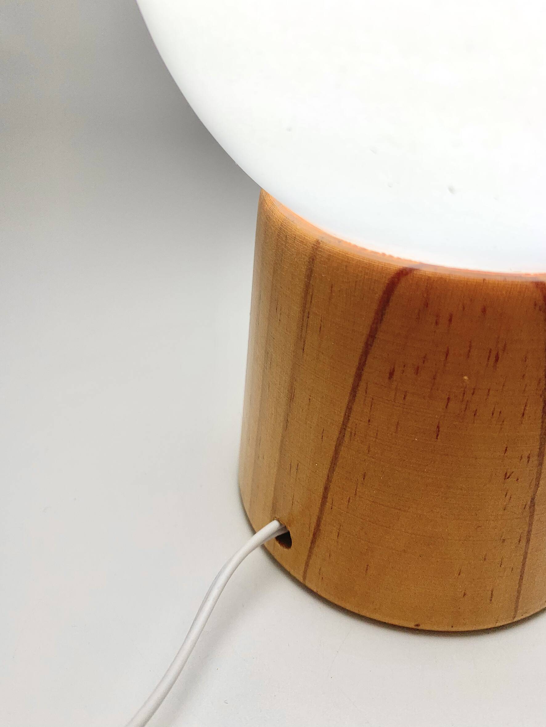 Pair of lamps with wooden base and glass globe, 1970s