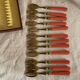 Set of 12 coral and gold dessert forks