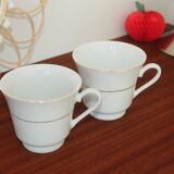 Set of 2 white porcelain cups with gold rim