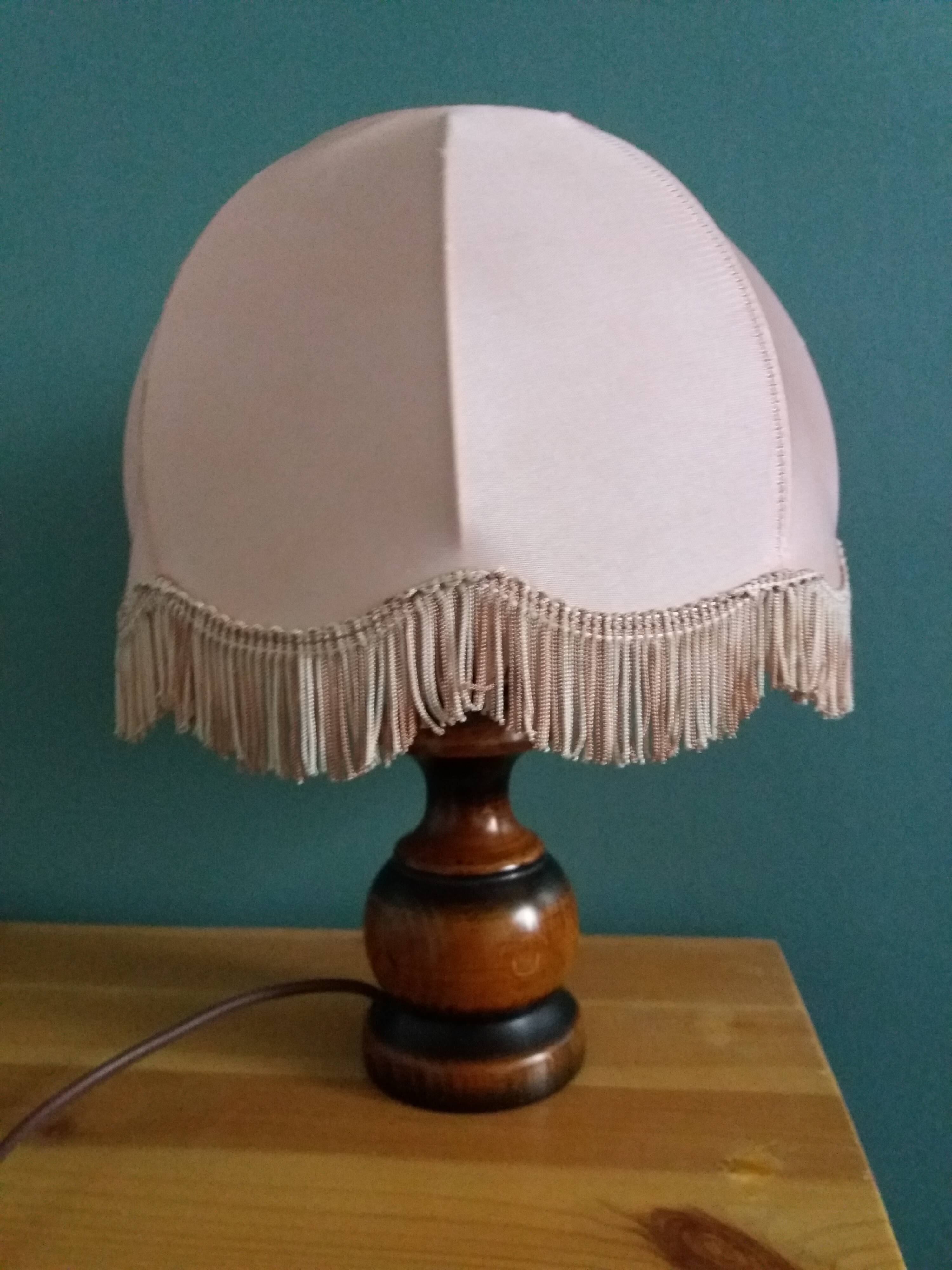 Turned wood bedside lamp with fabric lampshade