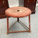 Red tripod industrial metal stool